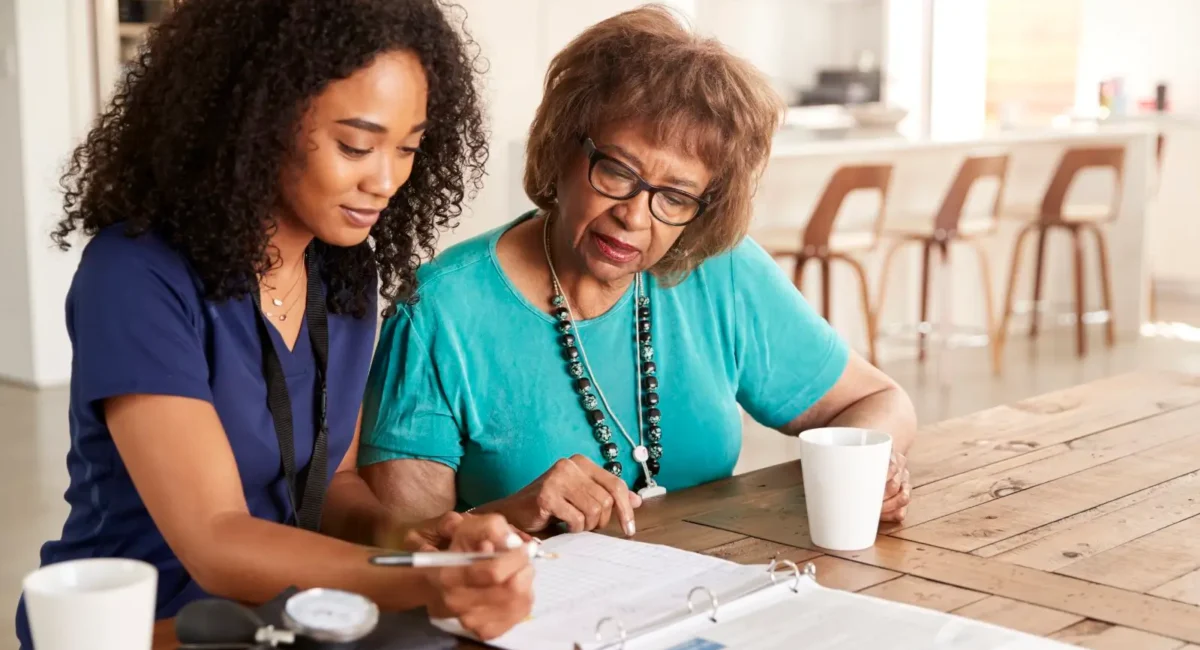 female-healthcare-worker-filling-in-a-form-with-a-2024-10-22-08-25-02-utc