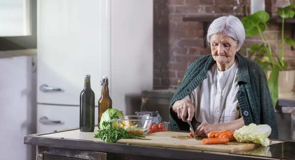 senior-woman-preparing-fresh-vegetables-in-kitchen-2026-01-07-00-32-47-utc-caringfamily